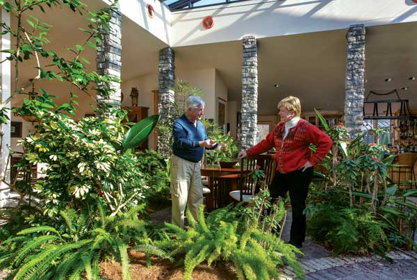 Some of Stu and Trina's favorite plants growing inside the atrium include their orange and lemon trees, which provide food as well as beautiful blooms and scents. Because of its many hours of sunlight—even in winter—the atrium is an ideal environment for tropical plants.